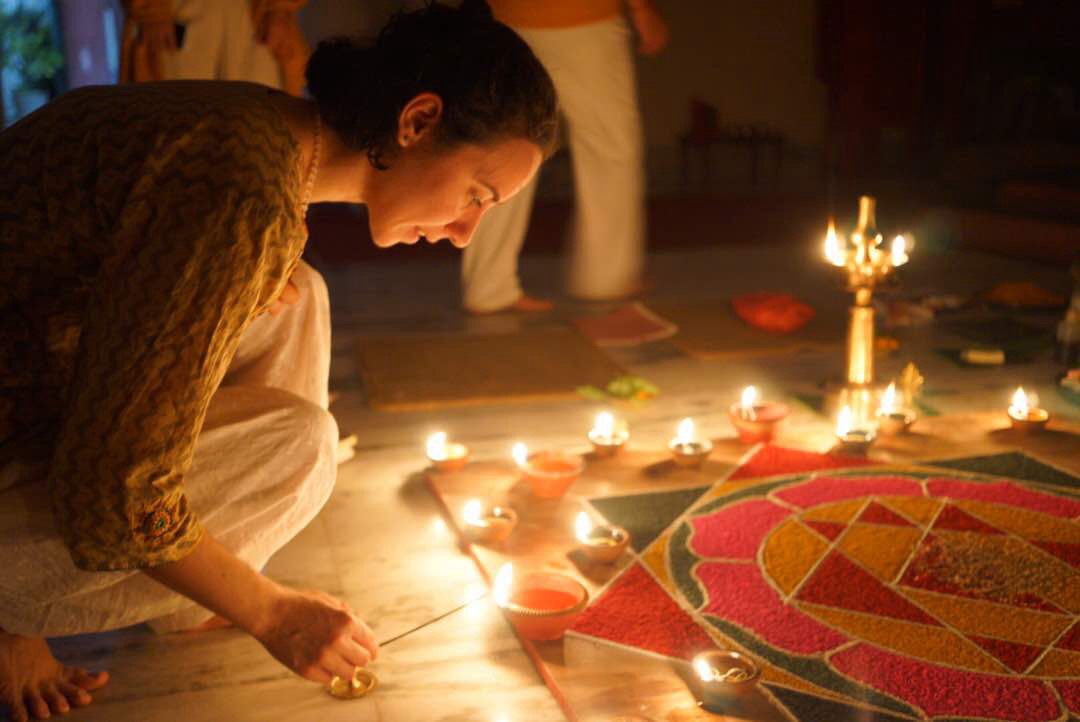Damla lighting a candle